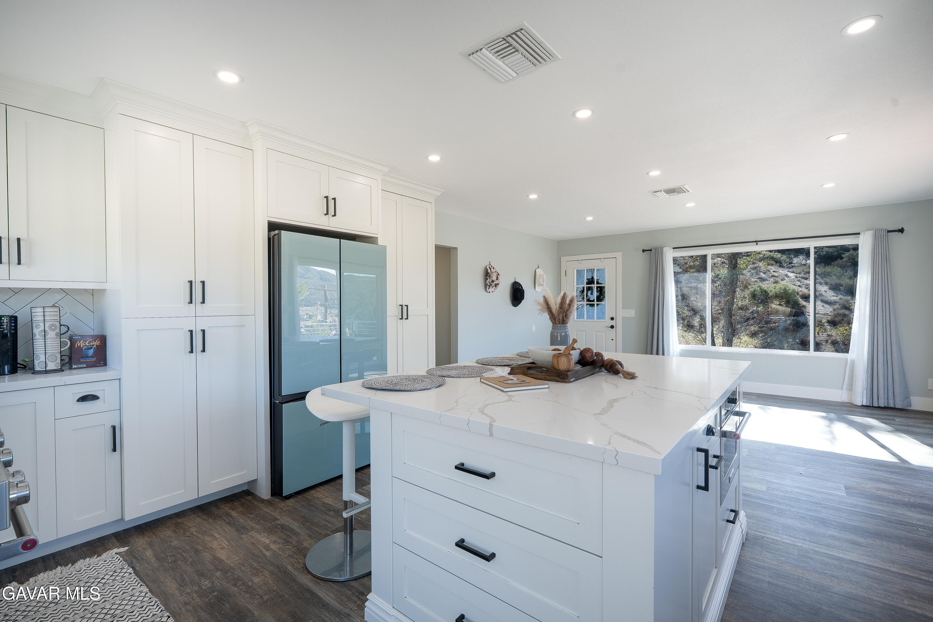 43379 Lookabout Road Lake Hughes, CA 93532 - Photo 17 of 50 a view of kitchen island with furniture and wooden floor