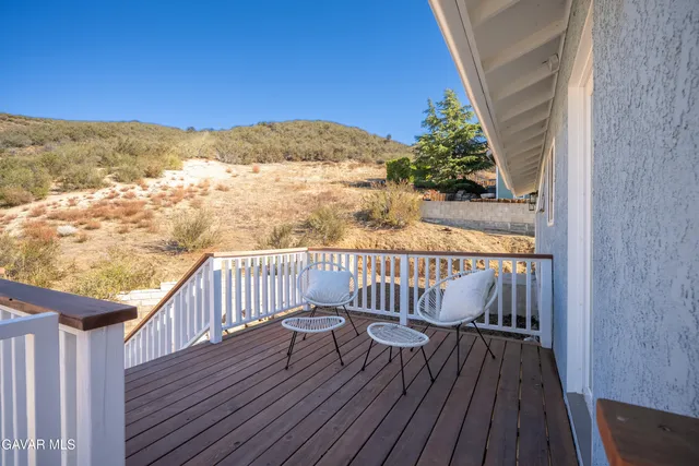 a view of a swimming pool with a lounge chair