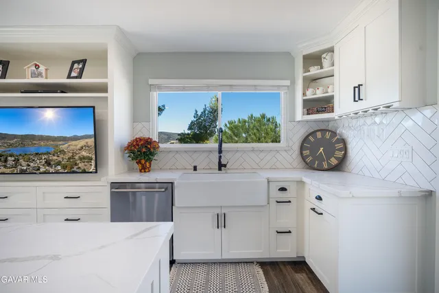 a view of the snow in between two of trees