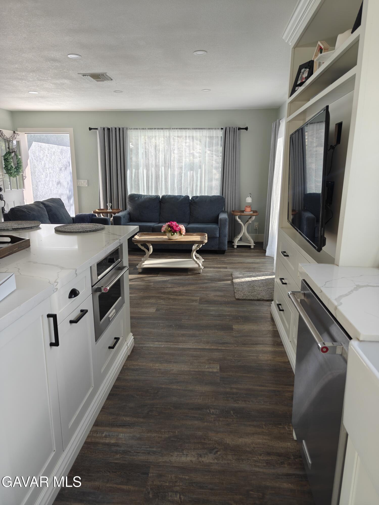 43379 Lookabout Road Lake Hughes, CA 93532 - Photo 2 of 50 a kitchen with stainless steel appliances a stove sink and a microwave