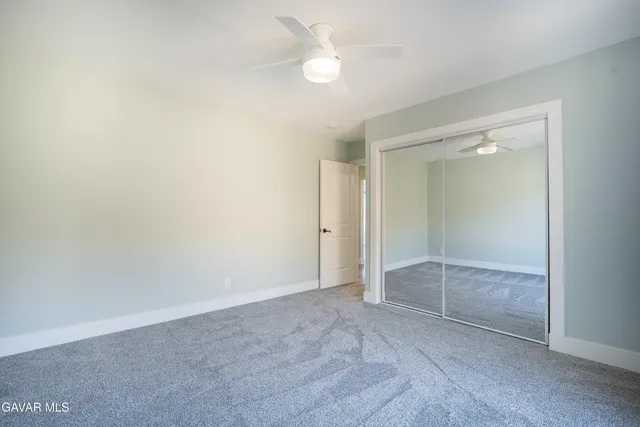 a picture of a bench in front of a window