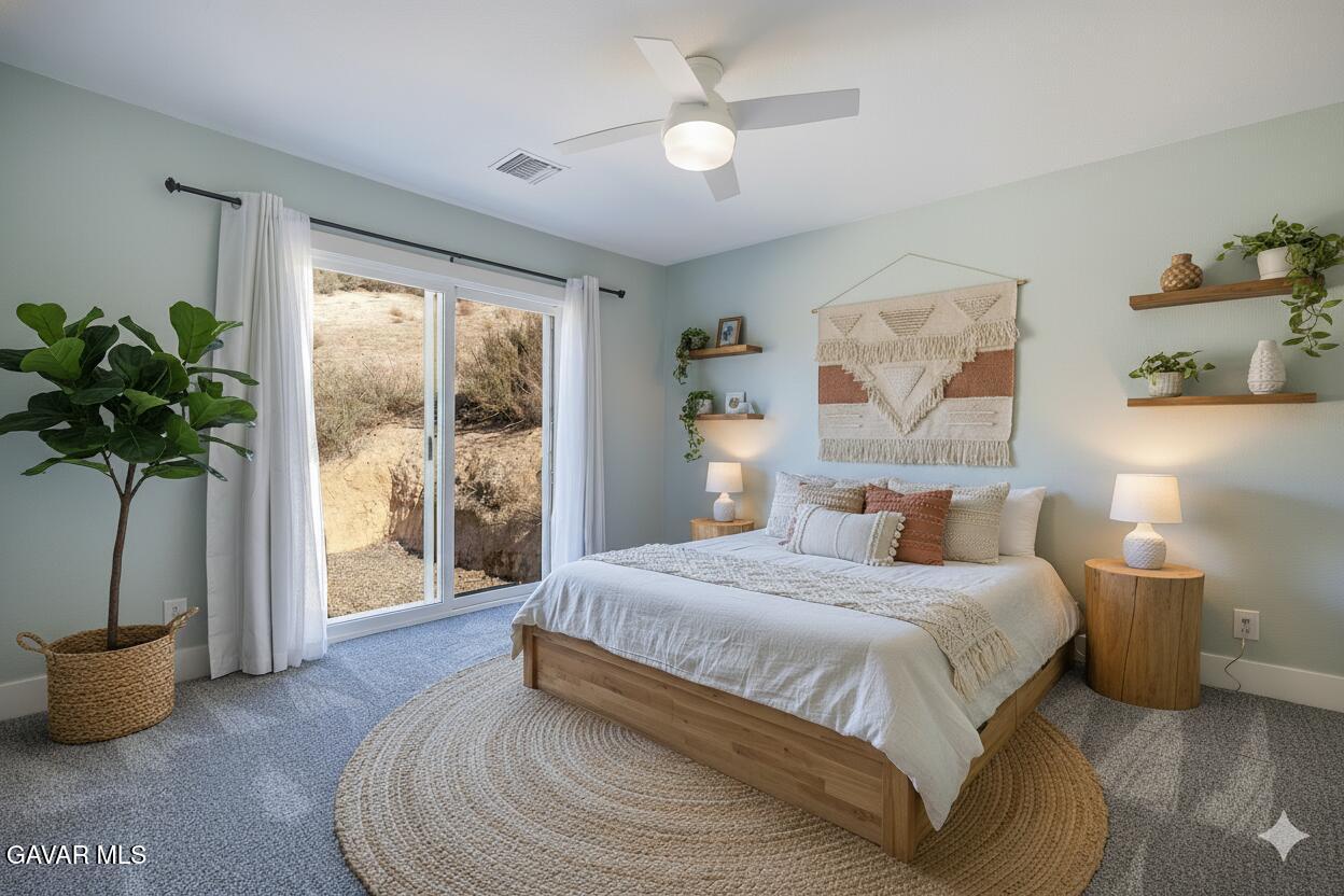 43379 Lookabout Road Lake Hughes, CA 93532 - Photo 24 of 50 a bedroom with a large bed and a potted plant