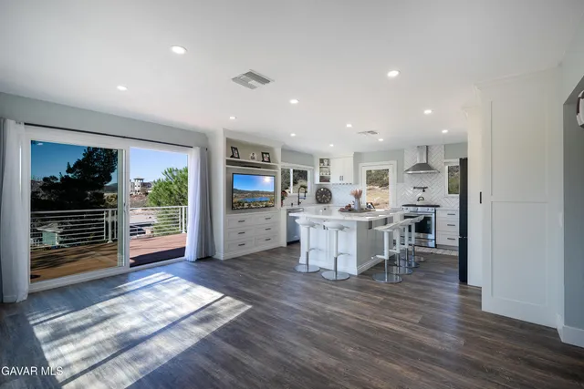 a view of balcony with wooden floor and fence