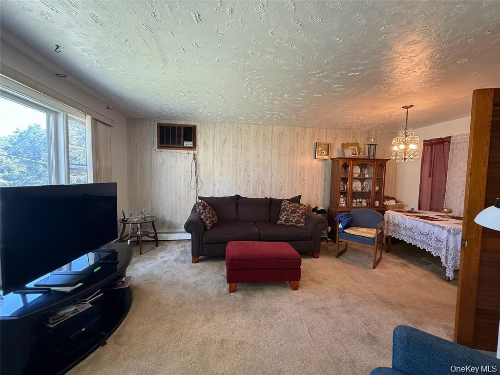 7 Dene Road Newburgh, NY 12550 - Photo 3 of 19 a living room with furniture and a flat screen tv