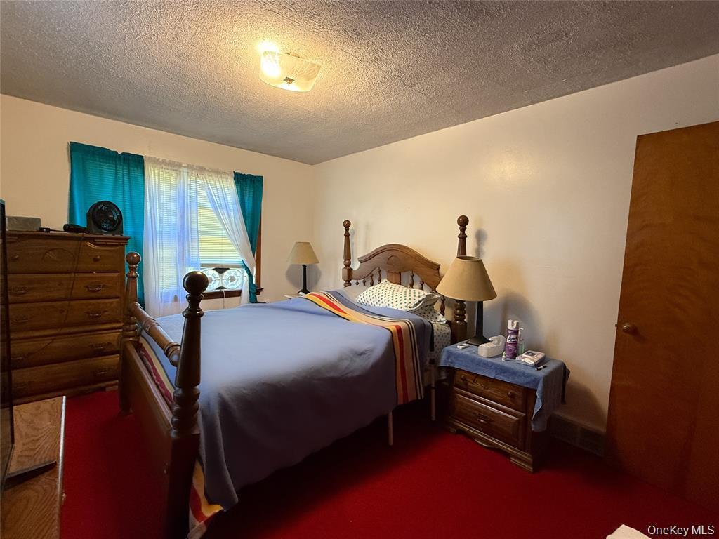 7 Dene Road Newburgh, NY 12550 - Photo 9 of 19 a bed room with a bed and a window