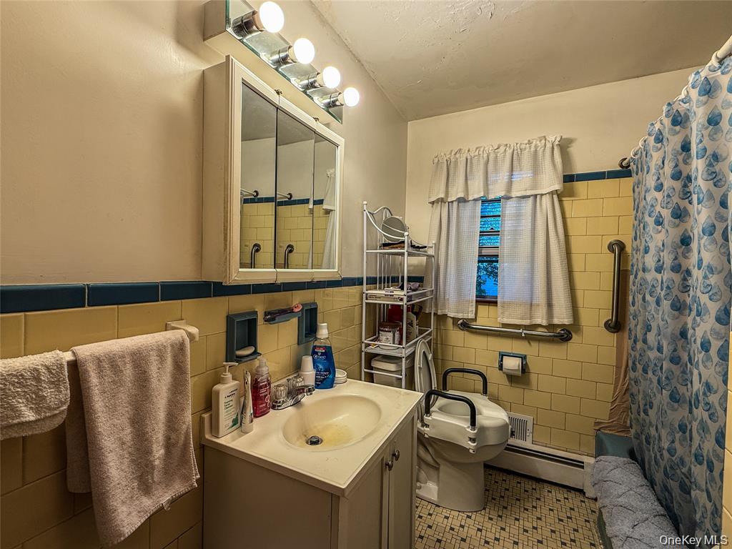 7 Dene Road Newburgh, NY 12550 - Photo 10 of 19 a bathroom with a sink toilet and shower
