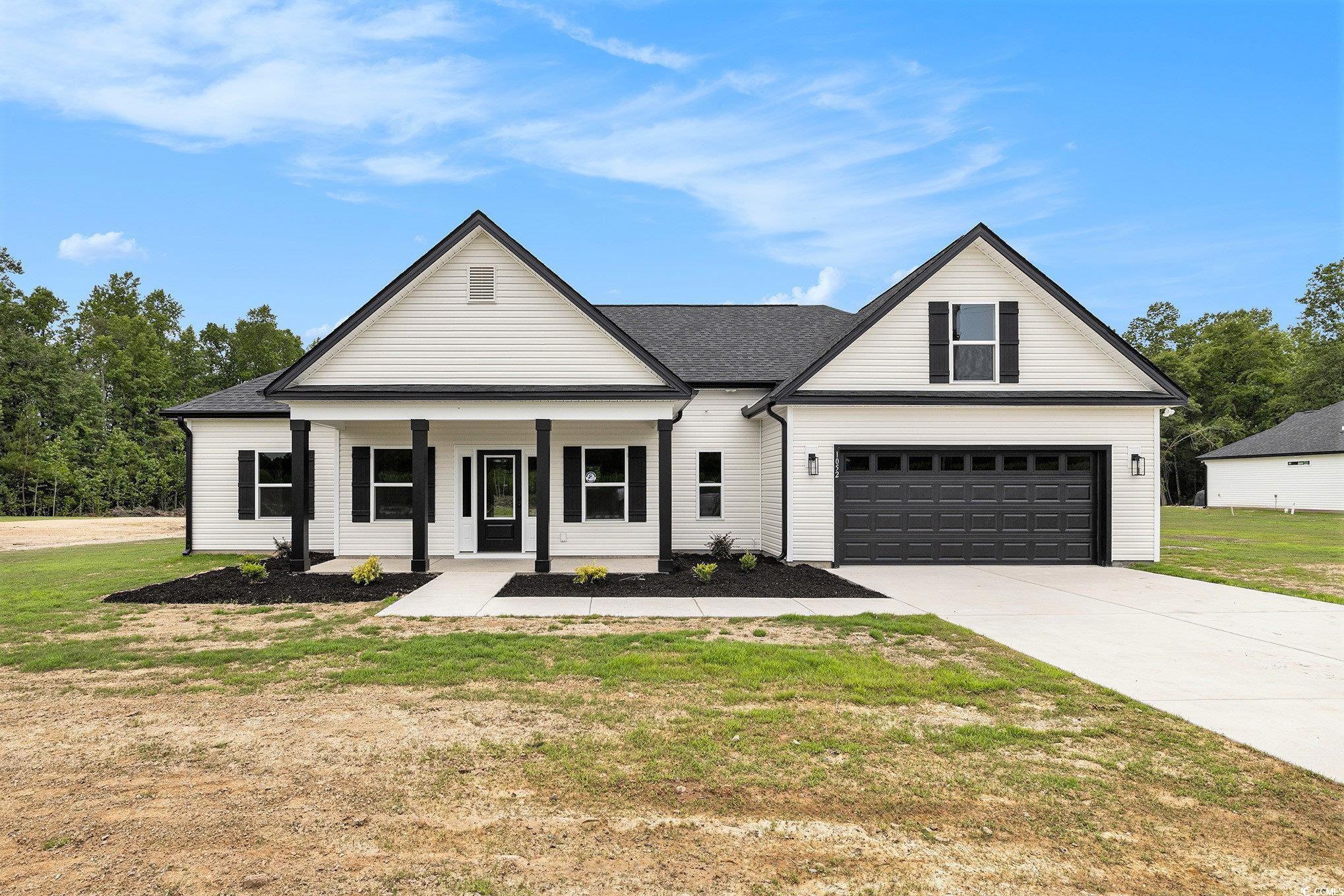 1052 Merritt Road Conway, SC 29526 - Photo 1 of 33 Modern farmhouse featuring concrete driveway, cove