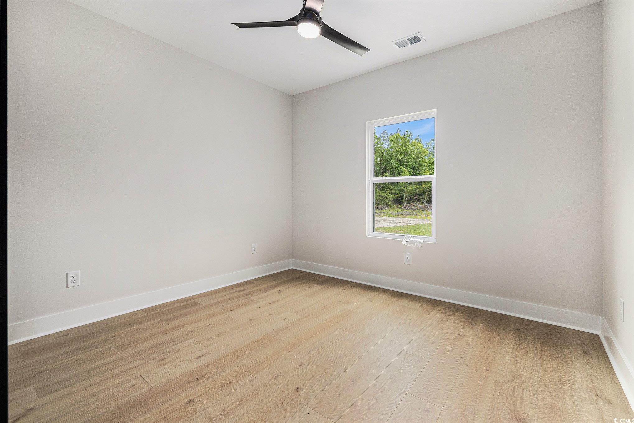 1052 Merritt Road Conway, SC 29526 - Photo 15 of 33 Empty room featuring baseboards, light wood-type f