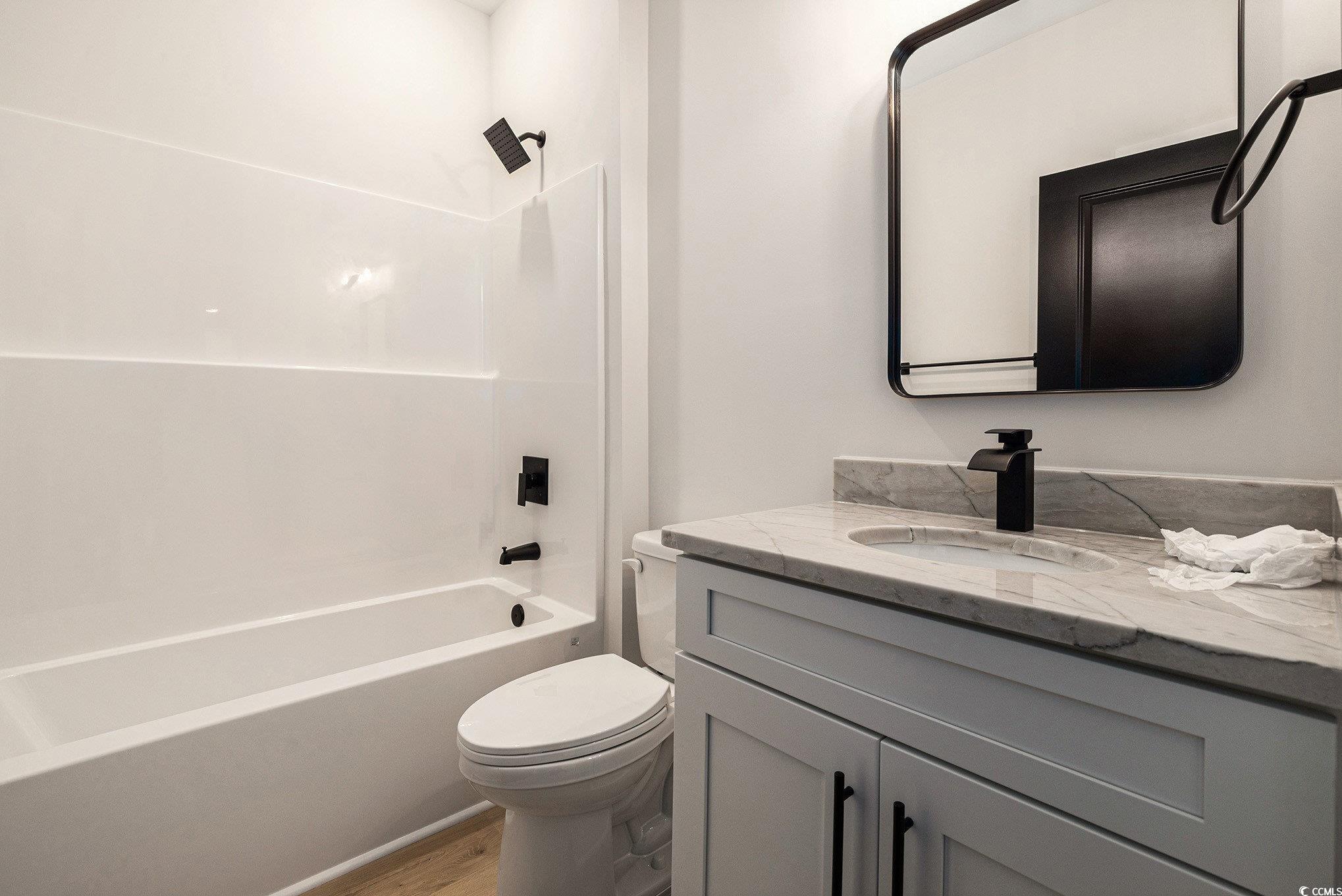 1052 Merritt Road Conway, SC 29526 - Photo 17 of 33 Full bath with vanity, toilet, wood finished floor