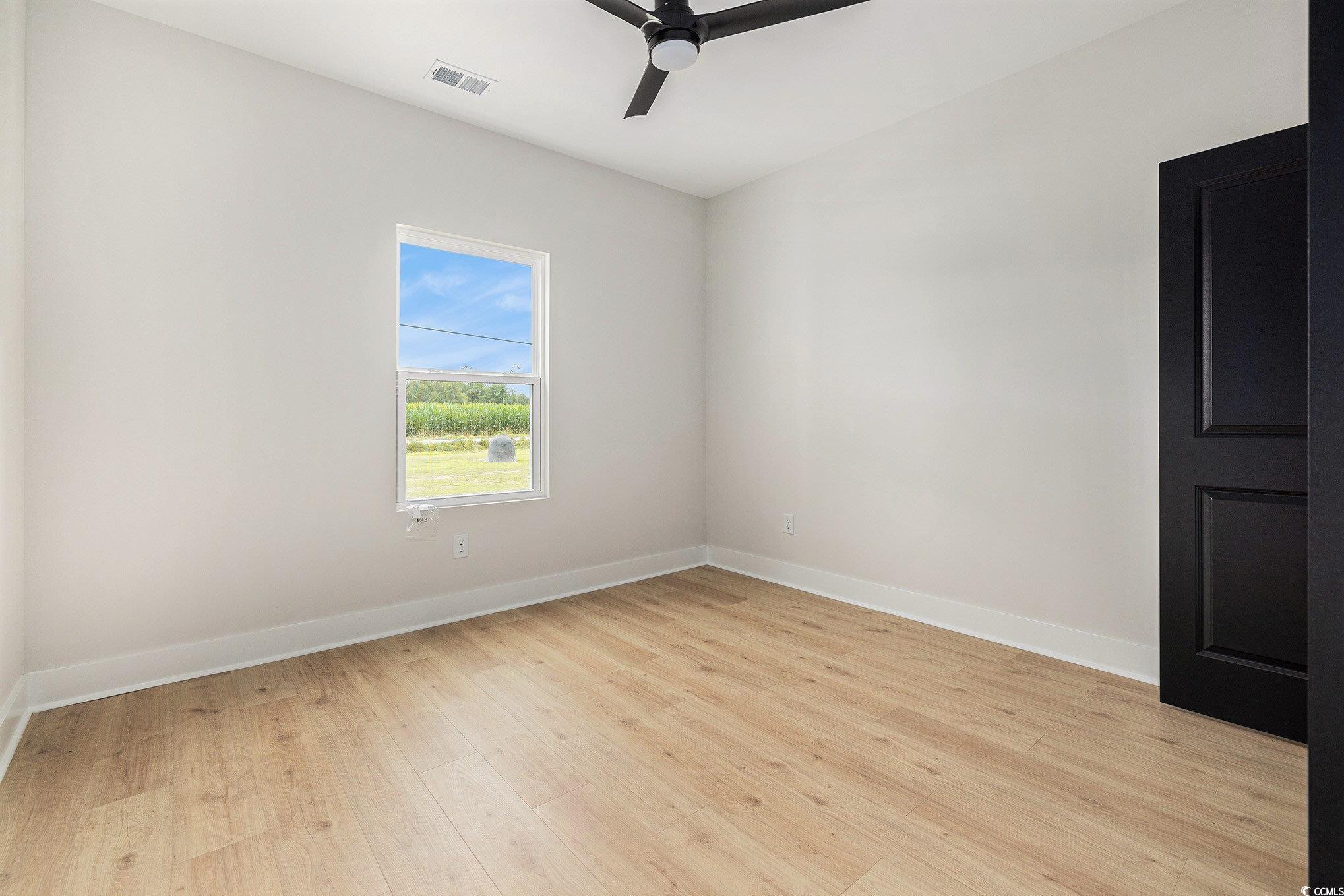1052 Merritt Road Conway, SC 29526 - Photo 18 of 33 Unfurnished room with a ceiling fan, light wood-st