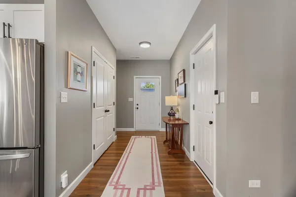 a view of a bathroom with mirror and a sink
