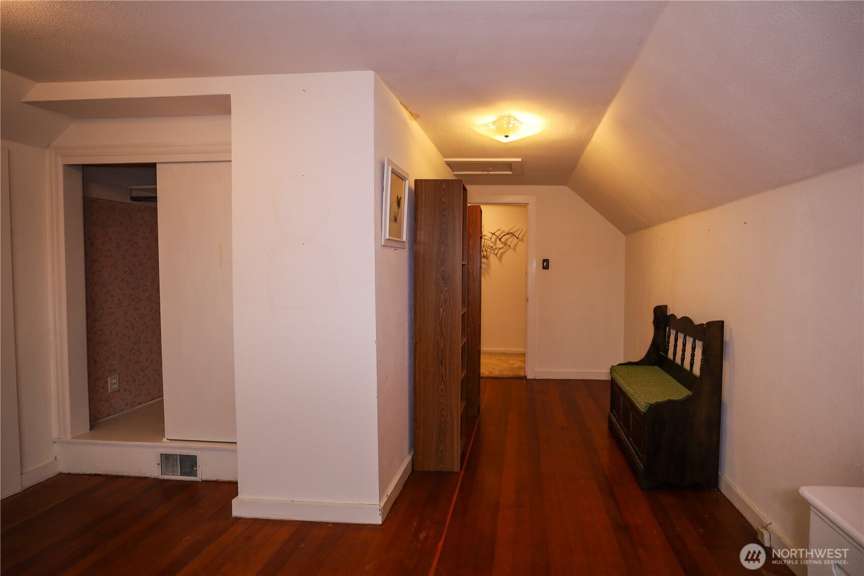 1302 Arnold Street Aberdeen, WA 98520 - Photo 15 of 23 a hallway with front door wooden floor and stairs