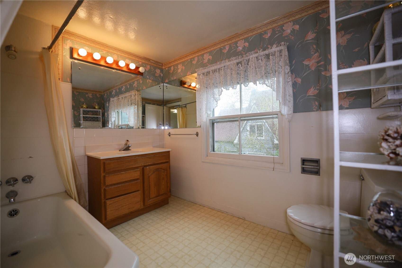 1302 Arnold Street Aberdeen, WA 98520 - Photo 17 of 23 a bathroom with a sink vanity mirror and toilet