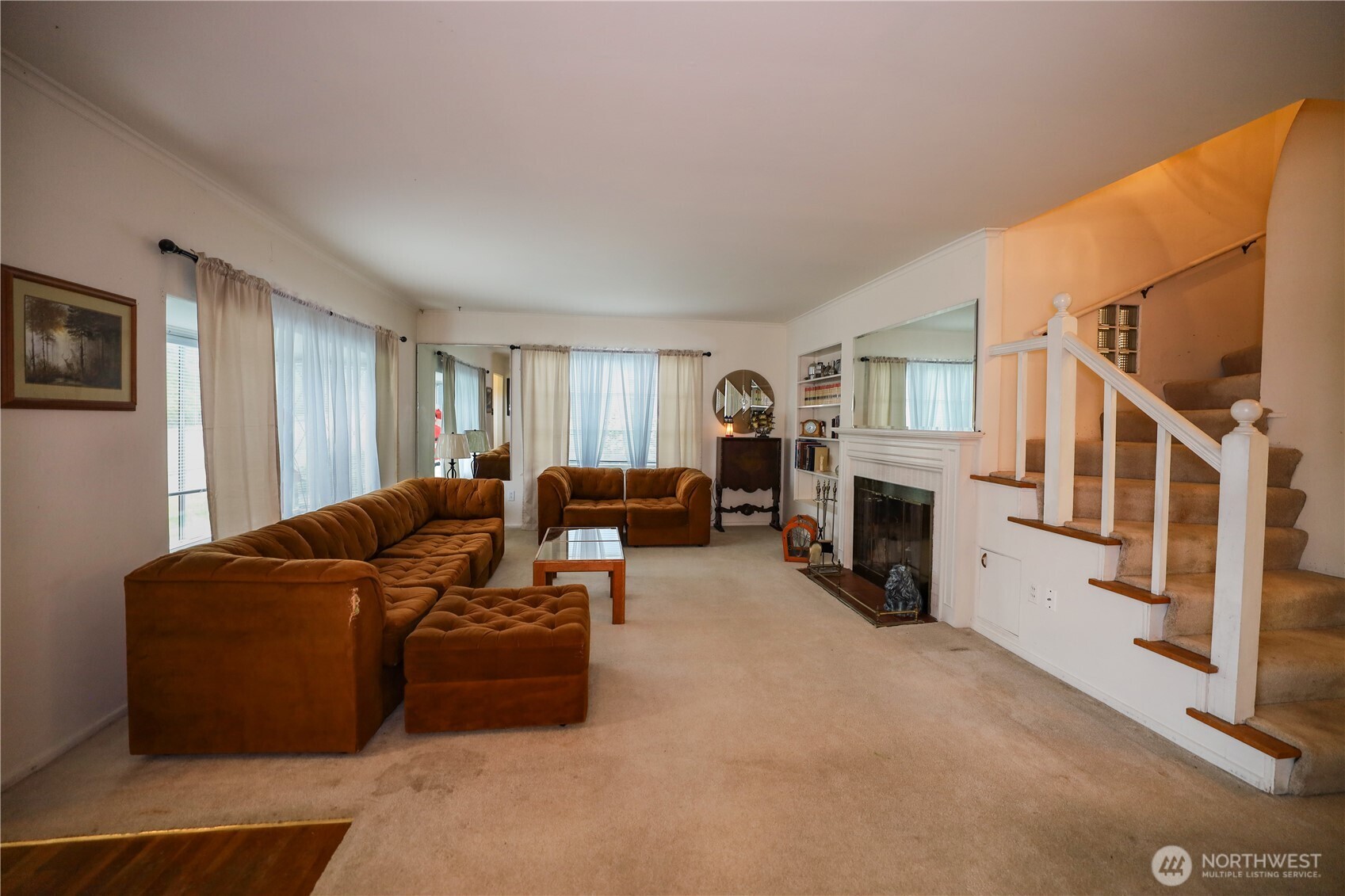 1302 Arnold Street Aberdeen, WA 98520 - Photo 4 of 23 a living room with furniture a fireplace and a flat screen tv