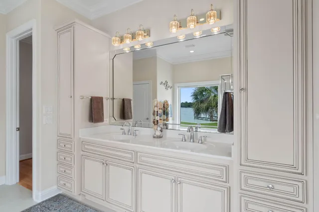 a spacious bedroom with a bed and dresser