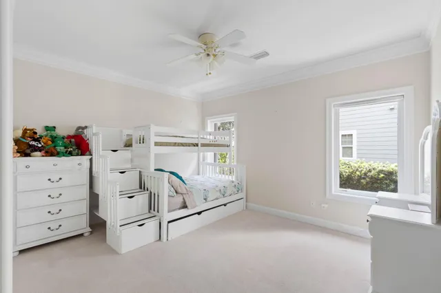a living room with furniture and a dining table with wooden floor