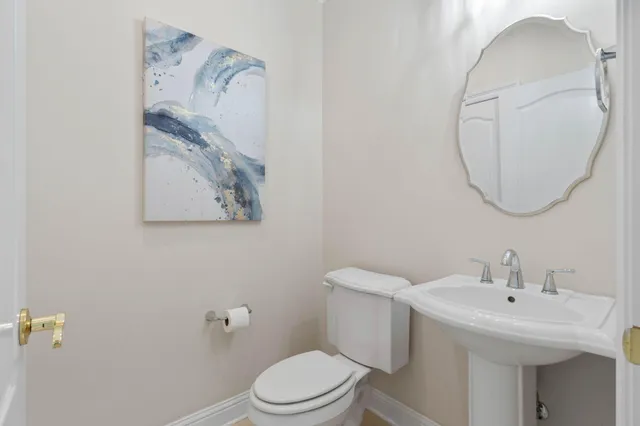 a view of a lake with houses in the back