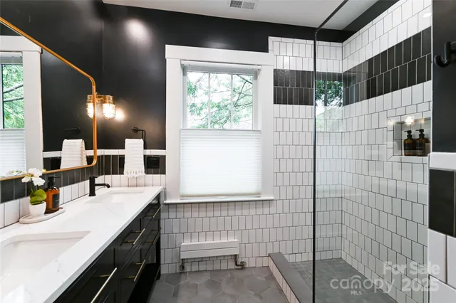 a bathroom with a sink and mirror