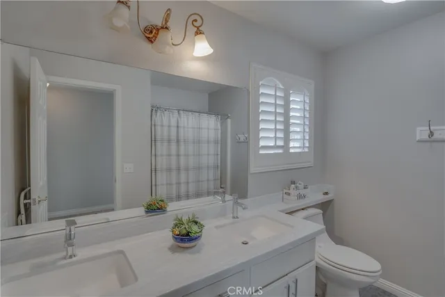 a view of a bathroom from a hallway