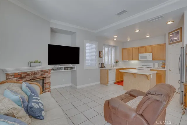 a kitchen with a sink a stove a refrigerator and cabinets