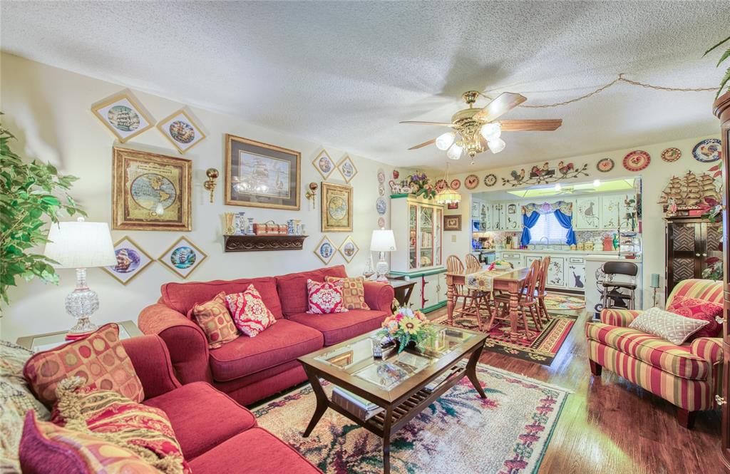 7040 Cognac Drive, Unit 3 New Port Richey, FL 34653 - Photo 19 of 31 a living room with furniture a couch and a chandelier