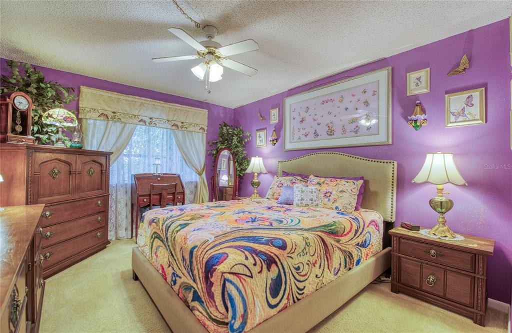 7040 Cognac Drive, Unit 3 New Port Richey, FL 34653 - Photo 21 of 31 a bedroom with a bed and a dresser