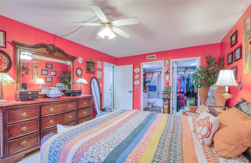 7040 Cognac Drive, Unit 3 New Port Richey, FL 34653 - Photo 26 of 31 a bed room with a bed and a walk in closet