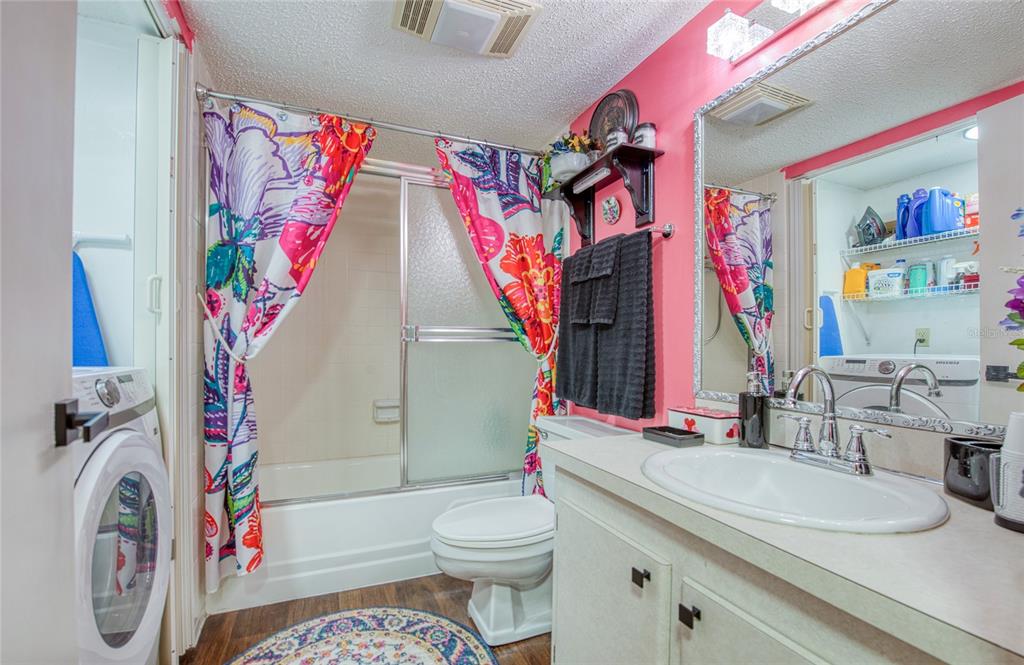 7040 Cognac Drive, Unit 3 New Port Richey, FL 34653 - Photo 28 of 31 a bathroom with a sink toilet and shower
