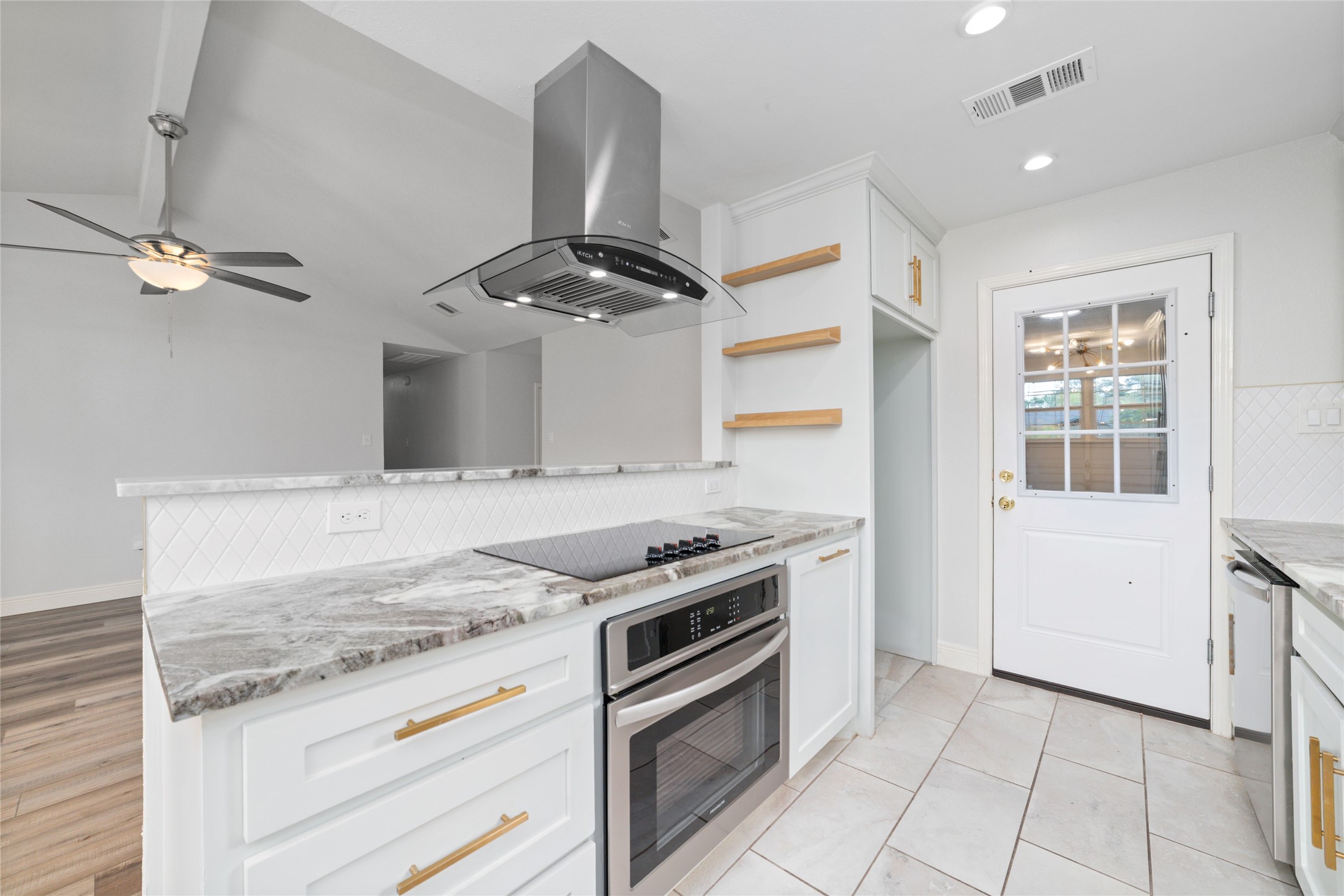 5922 Hummingbird Street Houston, TX 77096 - Photo 26 of 26 The kitchen, dining, and living areas all come together in one beautifully connected space that feels open, bright, and welcoming. It's the kind of floor plan that makes everyday life feel easier and every gathering feel a little more special.
