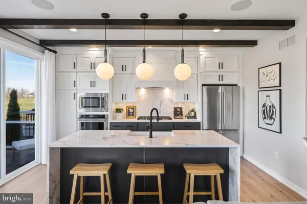 a kitchen with cabinets and window