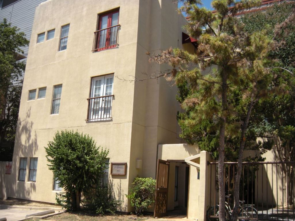 a view of a house with a tree