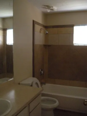 a bathroom with a shower and a toilet