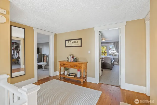 a bedroom with furniture and a gate