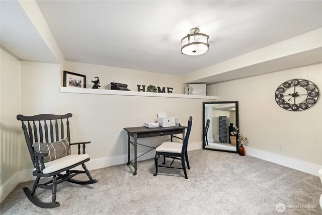a view of a livingroom with furniture and a table