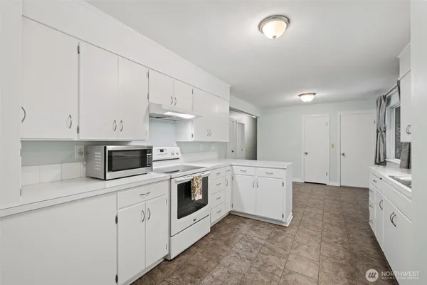 a kitchen with a sink and cabinets