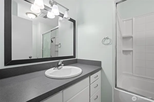 a bathroom with a toilet and shower