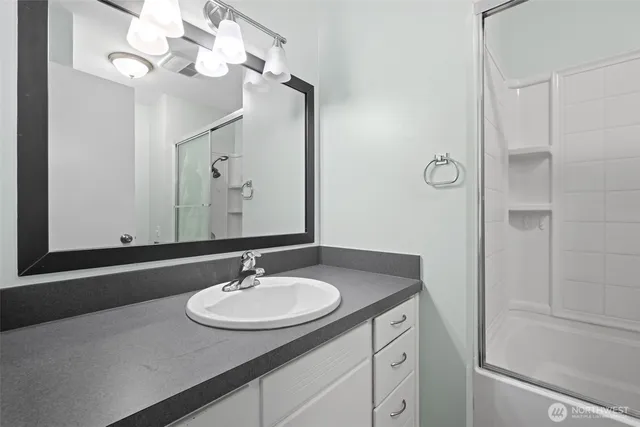 a bathroom with a toilet and shower