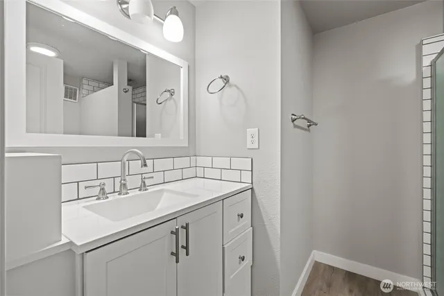 a room with wooden floor and pool table