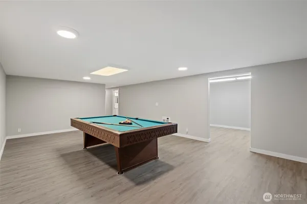 a view of a room with wooden floor and bathroom