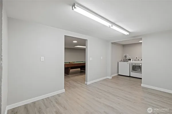 a view of a room with wooden floor