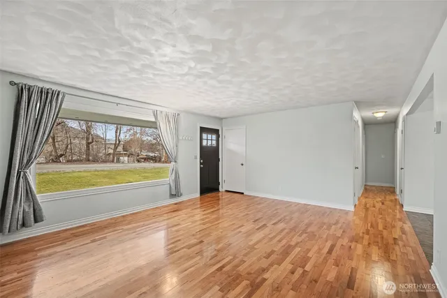 a view of an empty room and window