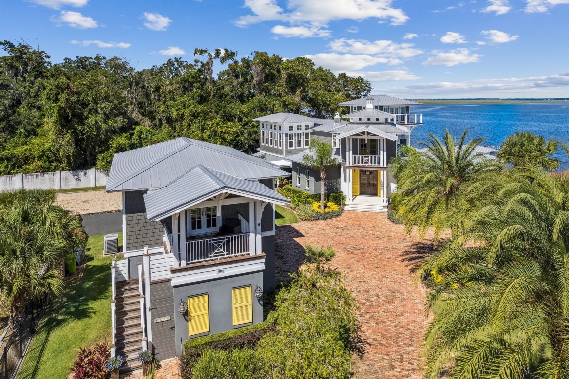 an aerial view of a house with a yard