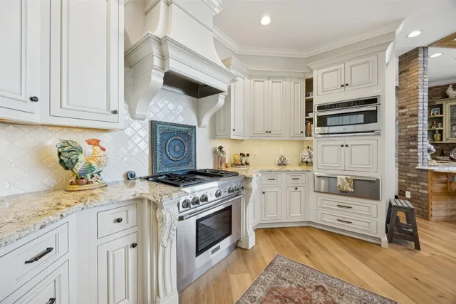 a view of a hallway view with wooden floor and windows