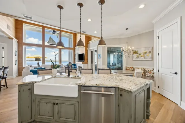 a kitchen with stainless steel appliances granite countertop a stove and a sink