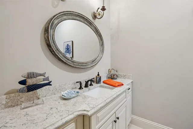 a living room with furniture a wooden floor and floor to ceiling window