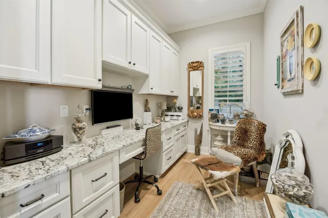 a view of a backyard with table and chairs under an umbrella