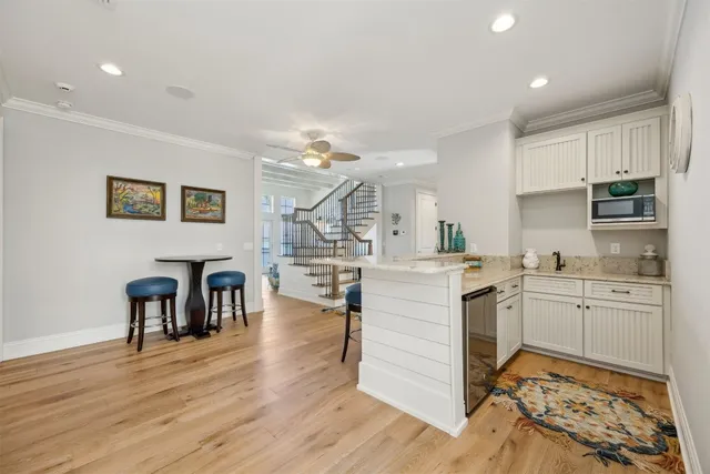 a view of a patio with a dining table and chairs