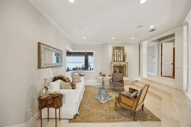a view of a kitchen with kitchen island a chandelier and refrigerator