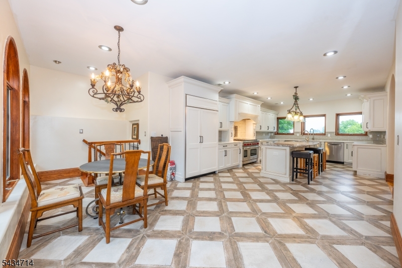 50 Rock Spring Road West Orange, NJ 07052 - Photo 11 of 50 a dining room filled chandelier and kitchen view