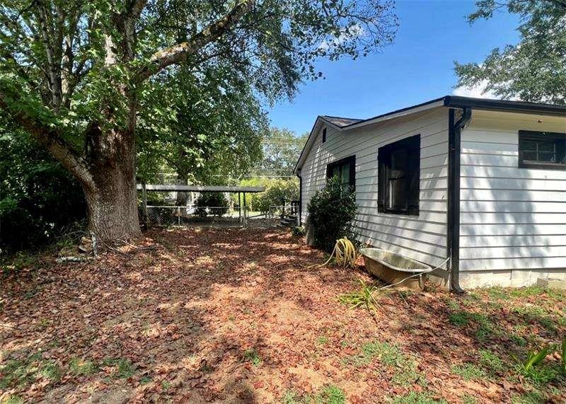 3521 Clay Road Southwest Austell, GA 30106 - Photo 11 of 13 a backyard of a house with table and chairs